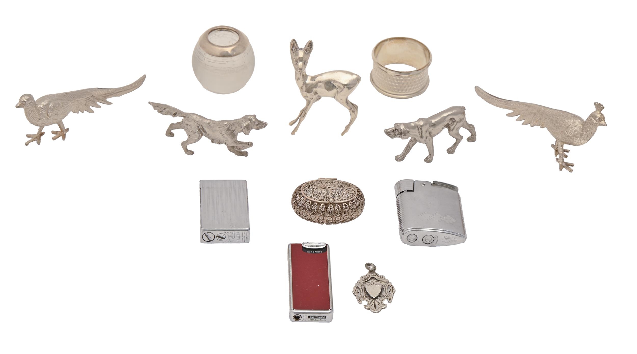 A silver filigree box, 20th c, 52mm l, a silver napkin ring, silver mounted glass match stand and