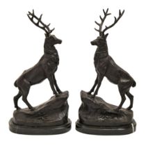 A pair of bronzed metal sculptures of deer cast from models by Jules Moignez, on marble base, 43cm h