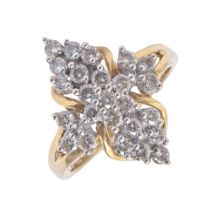 A diamond ring, in the form of a cruciform cluster, in 18ct gold, Convention marked, 6.1g, size M