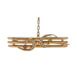 An Edwardian ruby, peridot and split pearl bar brooch, in gold, 43mm l, marked 9ct, 2.9g Good