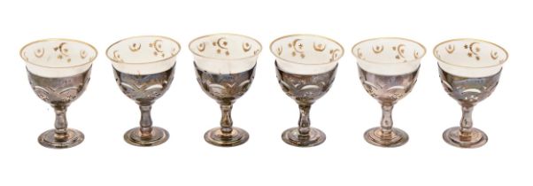 A set of six Edwardian pierced silver goblets and contemporary Turkish style gilt porcelain cups,