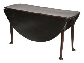A George III oak drop leaf table,  73cm h, 140cm l Top surface with shrinkage cracks and screw
