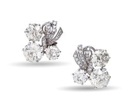 A pair of French diamond earrings,  mid 20th c, of stylised floral design with three principal