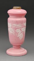 A Victorian blancmange pink glass oil lamp and stand, painted in white enamel with blackberries,