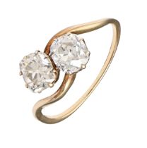 A diamond ring,  with two cushion shaped old cut diamonds, in gold, 3.7g, size S Some wear to hoop