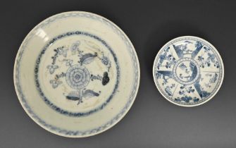 A Chinese blue and white plate from the Tek Sing Cargo, c1820, painted with a peony in diaper