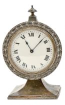 An EPNS timepiece in the manner of Liberty & Co, c1910, with enamel dial, on flared square foot