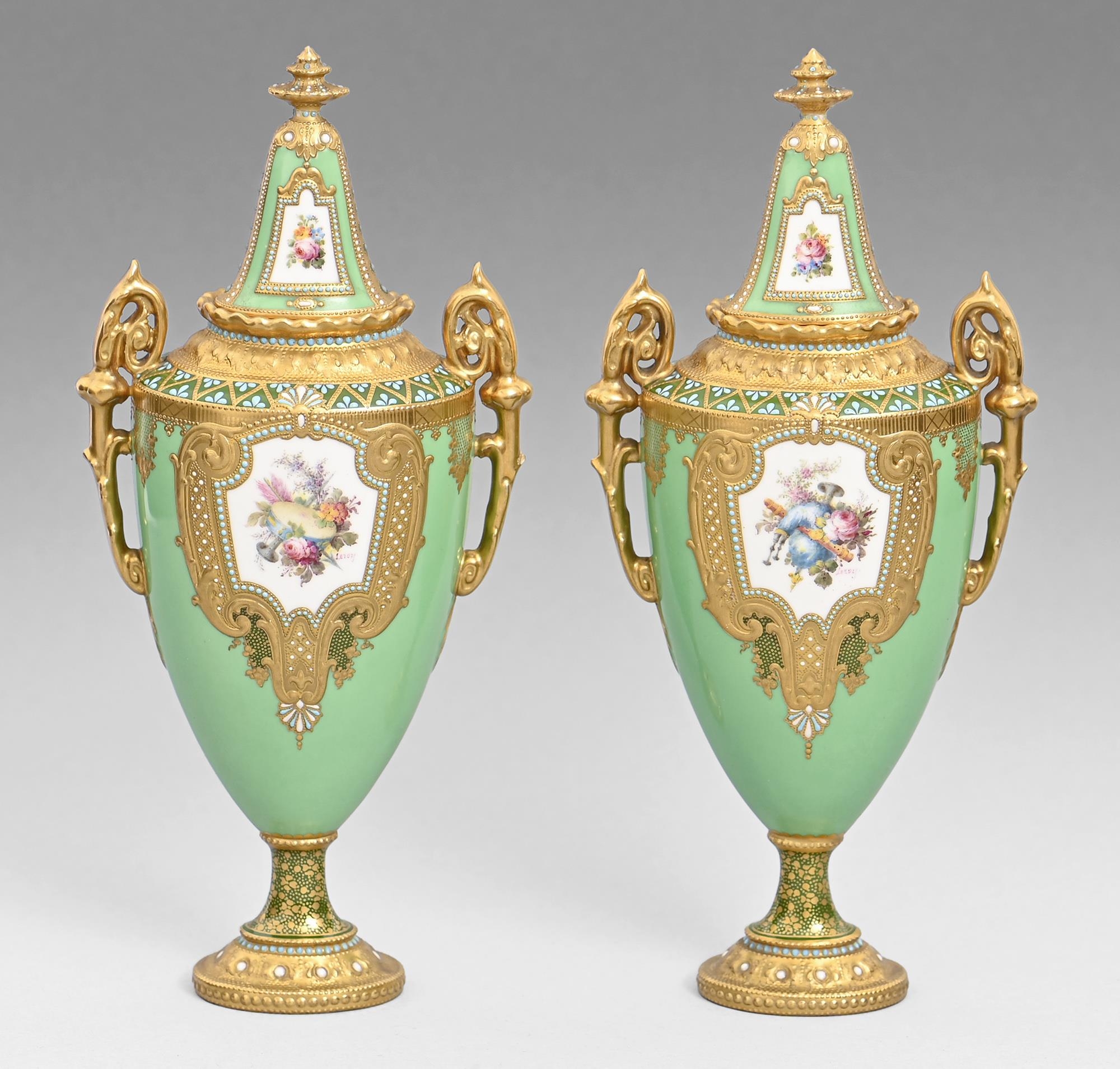 A pair of Royal Crown Derby vases and covers, 1908, painted by Leroy, signed, with flowers and a