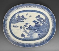 A Chinese export blue and white dish, late 18th c, painted with a river scene in spearhead and