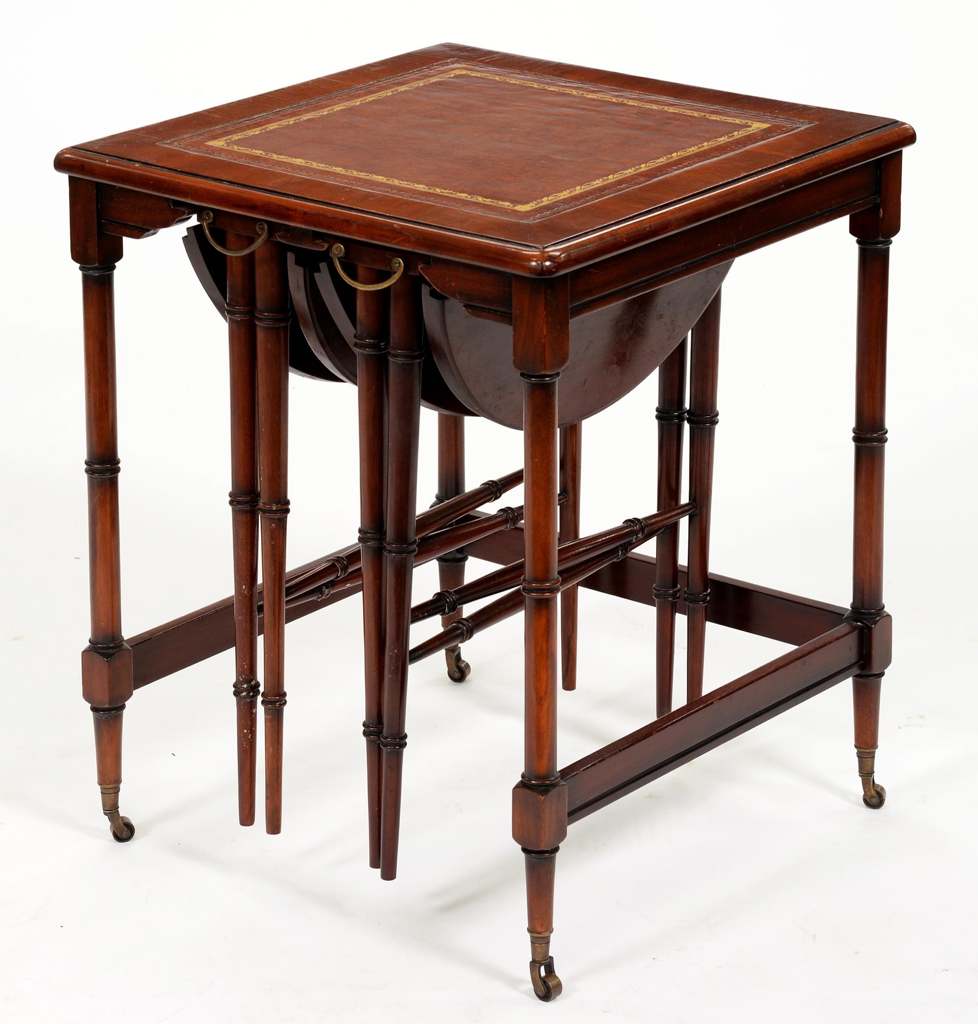 A mahogany nest of tables in faux bamboo Regency style, with inset tooled leather top, on brass - Image 2 of 2