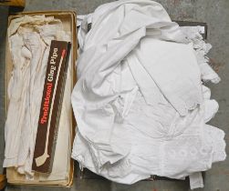 A quantity of early 20th c and later linen christening and similar gowns and a quantity of clay