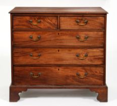 A George III mahogany chest of drawers, on bracket feet, 105cm h; 110 x 55cm Old repairs to
