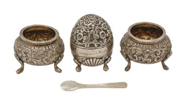 An Indian, silver repousse pepperette and pair of salt cellars, Kutch, c1900, pepperette 51mm h,