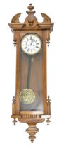 A Victorian mahogany fretwork framed mirror, 92 x 49cm and an early 20th c Vienna wall clock, with