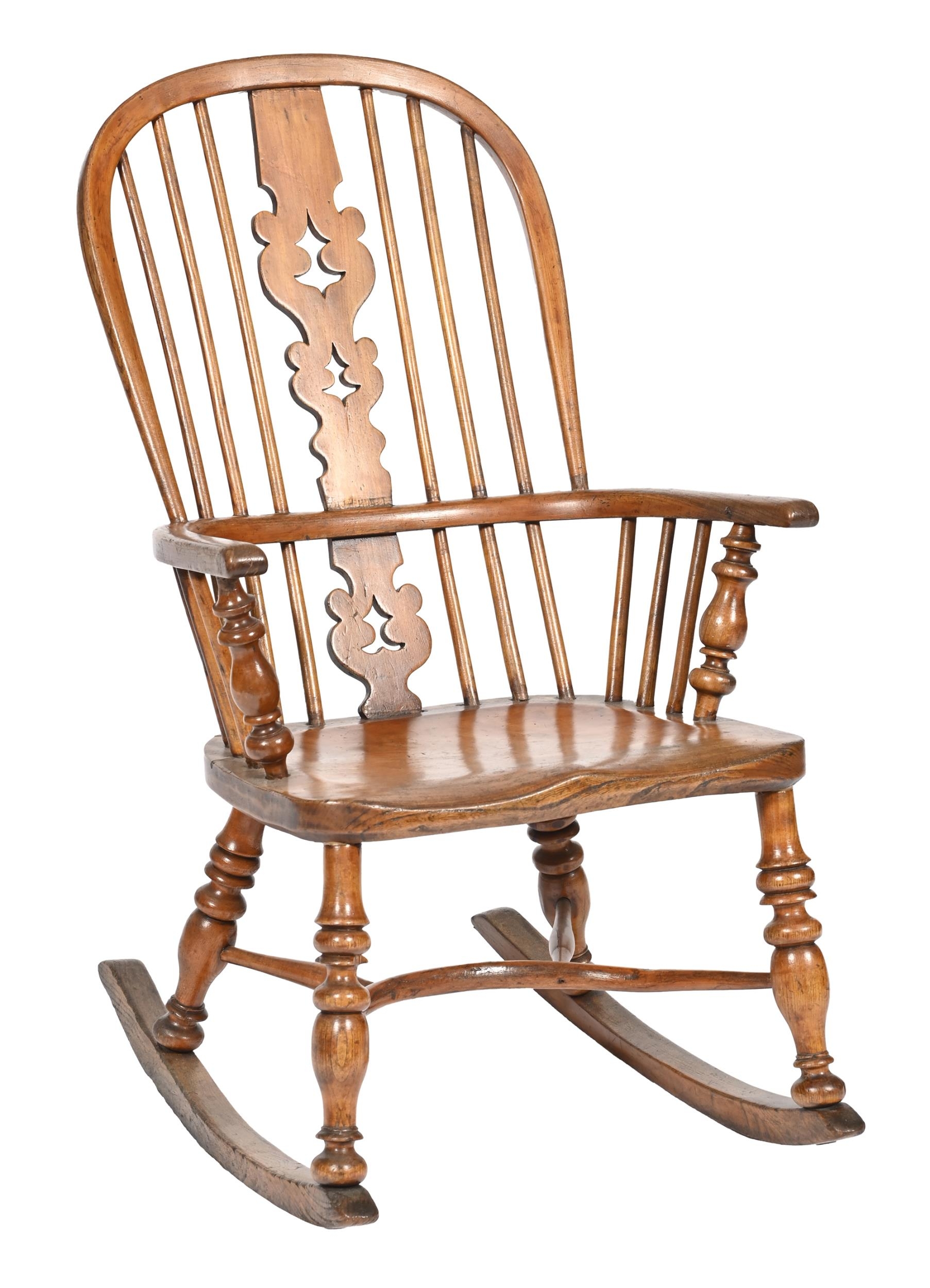 A Victorian yew and elm Windsor rocking chair,  with pierced splat and spindle back, turned legs and