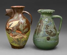 English art pottery. Two C H Brannam slipware jugs, decorated by James Dewdney or by Frederick