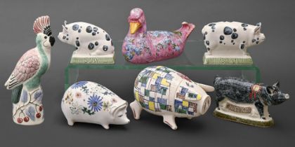 Seven Rye Pottery animals, comprising a pinhole pierced pig, patchwork painted pig shaped jar and