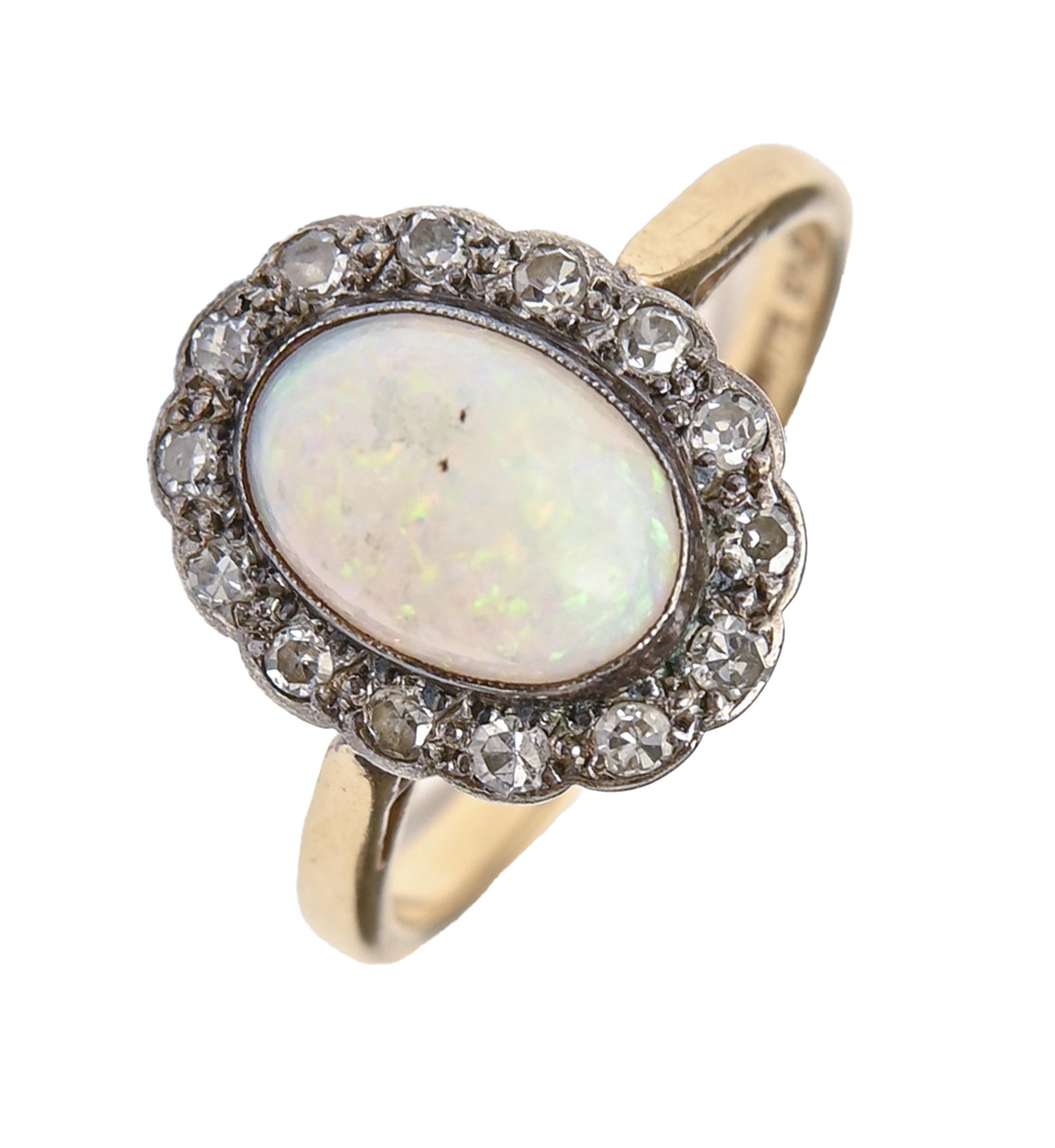 An opal and diamond ring, gold hoop marked 18ct WHITE GOLD, 3.1g, size K Opal polish dull from