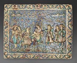 A Qajar style relief moulded tile, 20th c, of a group of musicians and other figures before a