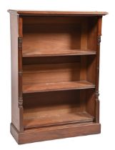 A William IV mahogany open bookcase, finely carved to side pilasters, adjustable shelves