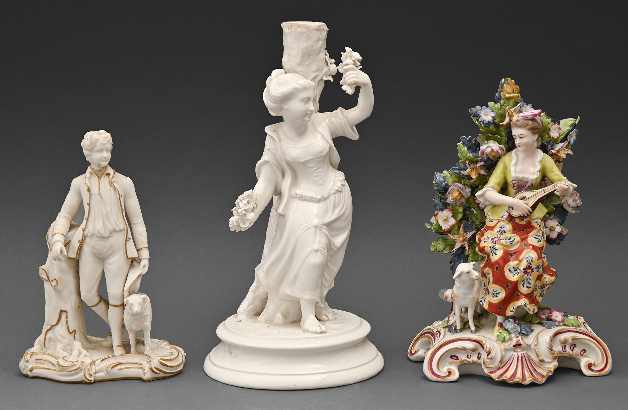 A Continental porcelain figure of a shepherdess playing the mandolin, 20th c, 21cm h, spurious