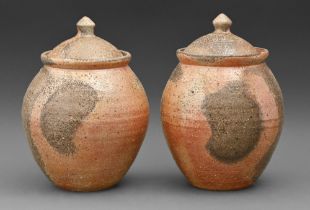 Studio pottery. Pair of jars and covers, thrown, rough textured stoneware, ash glazed, 26cm h