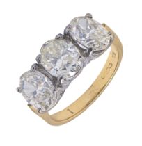 A diamond ring, with three oval brilliant cut diamonds, in 18ct gold, Convention marked, 4g, size