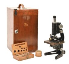 A compound microscope, W Watson & Sons "Service", finished in black with accessories, in fitted wood