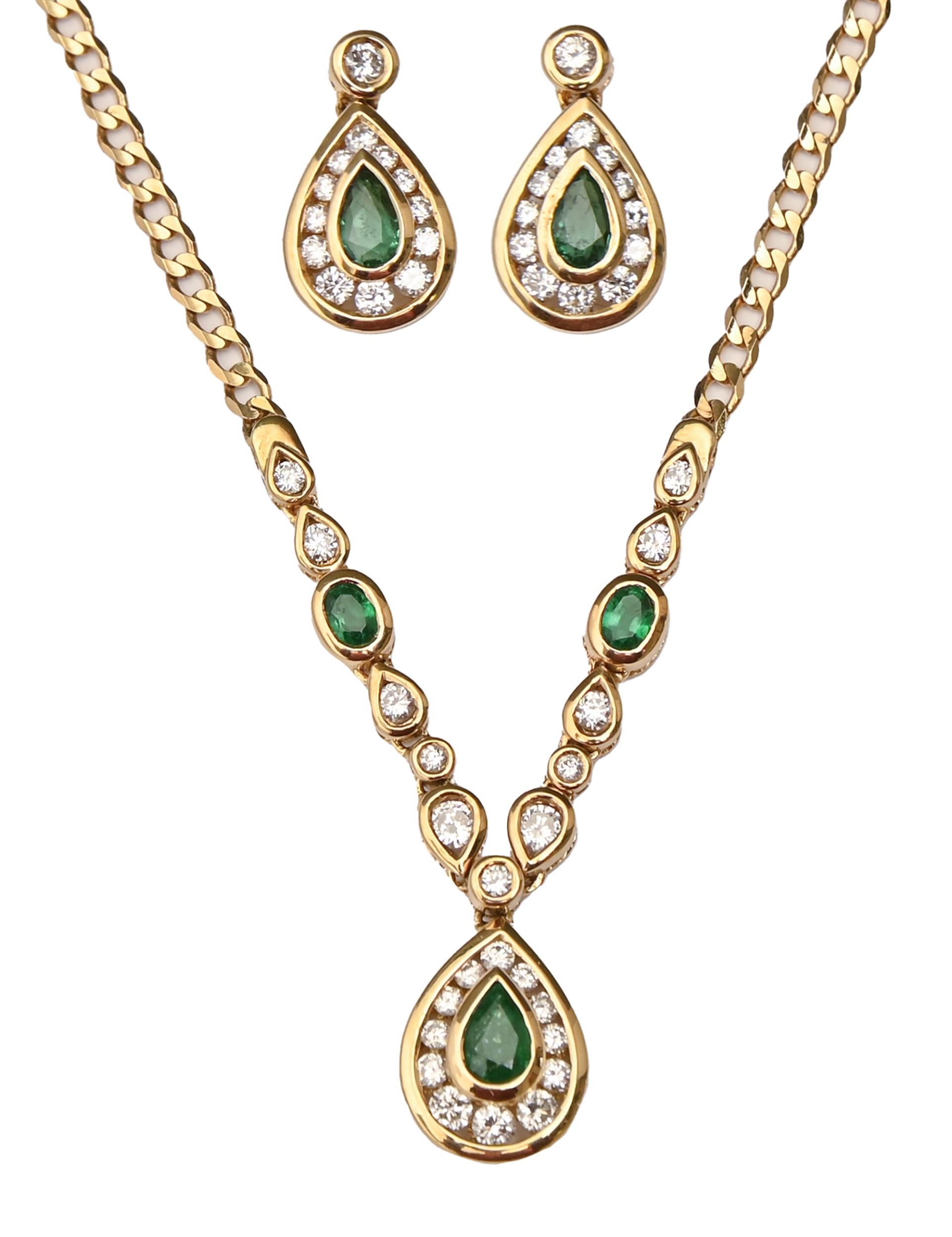 An emerald and diamond necklet, with pear shaped drop, in gold, 44cm l, marked 750 and a pair of
