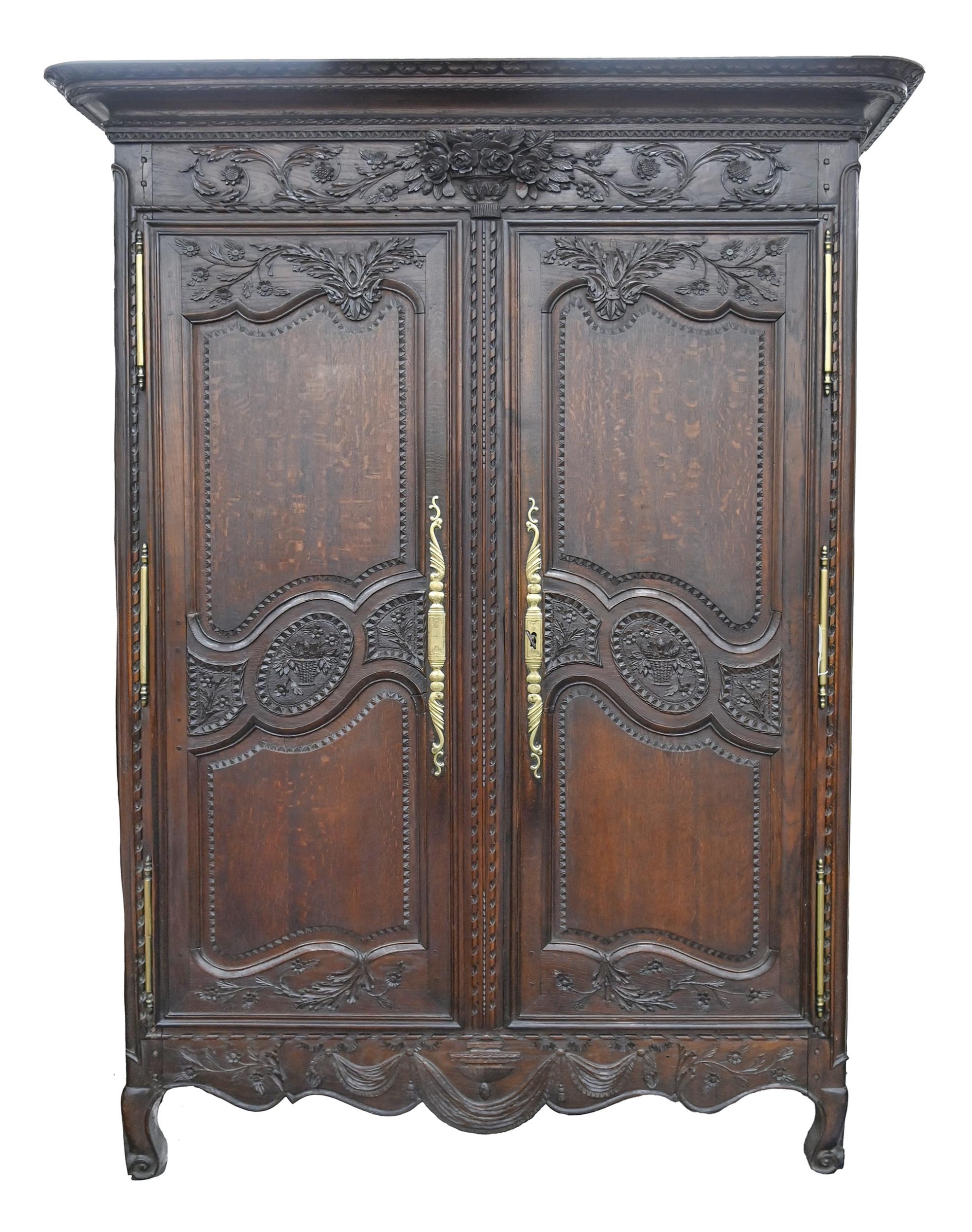 A Louis XVI French provincial carved walnut armoire, 227cm h; 160 x 64cm Minor chips and losses to