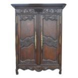 A Louis XVI French provincial carved walnut armoire, 227cm h; 160 x 64cm Minor chips and losses to
