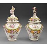 A pair of Samson floral encrusted jars and covers, c1900, with boy or girl figural finial and