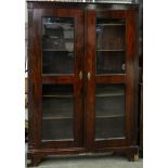 A grained rosewood bookcase, 19th c, fitted with adjustable shelves enclosed by a pair of glazed