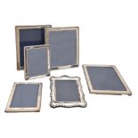 A pair and a set of three Elizabeth II silver photograph frames, with beaded surround, 30 x 25cm and