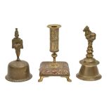 Two English brass hand bells, late 19th c, 18 and 19cm h and a copper and brass candlestick (3)