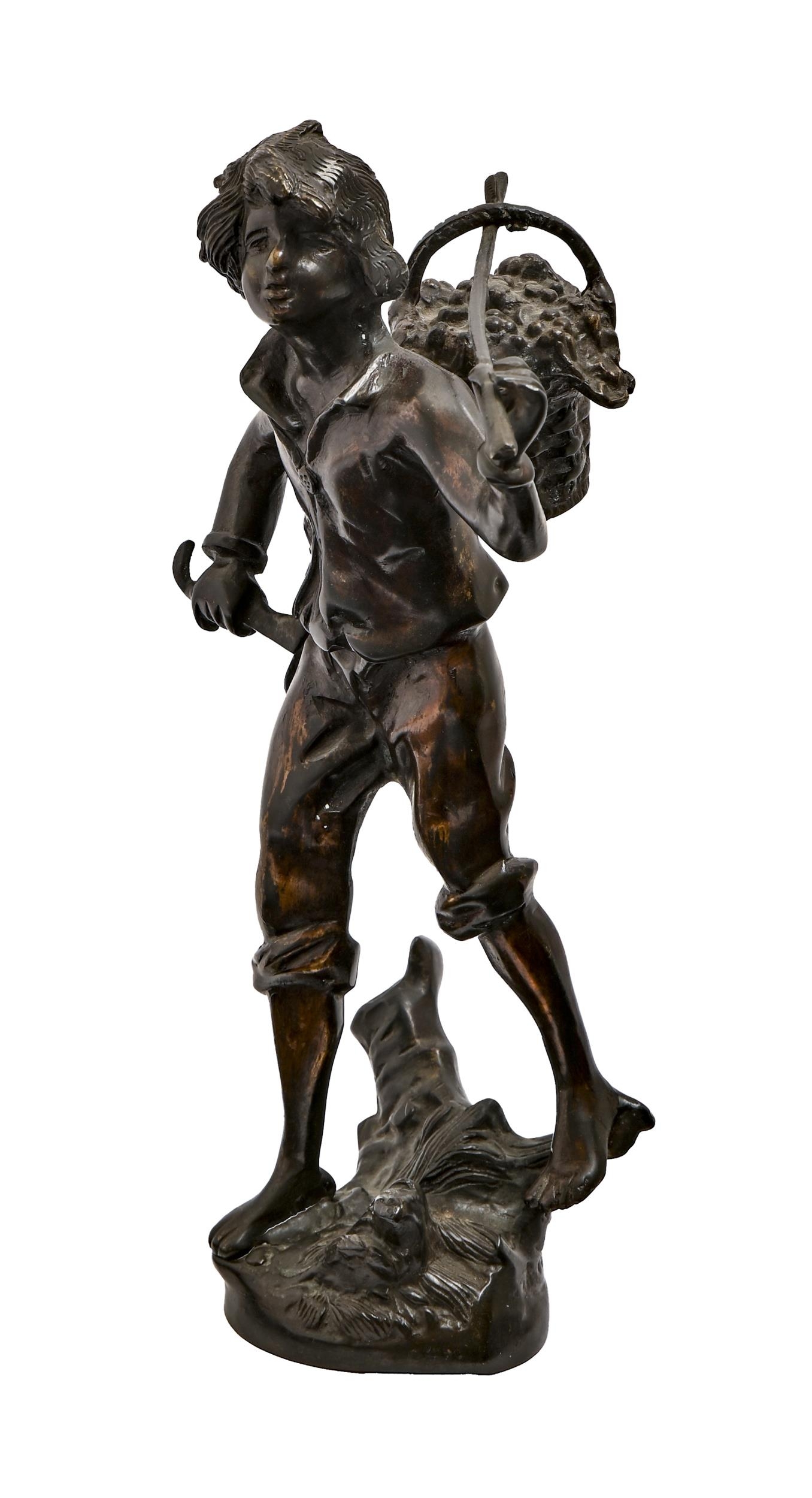 A bronze sculpture of a bare foot French boy carrying a basket of fruit on a pole over his shoulder,