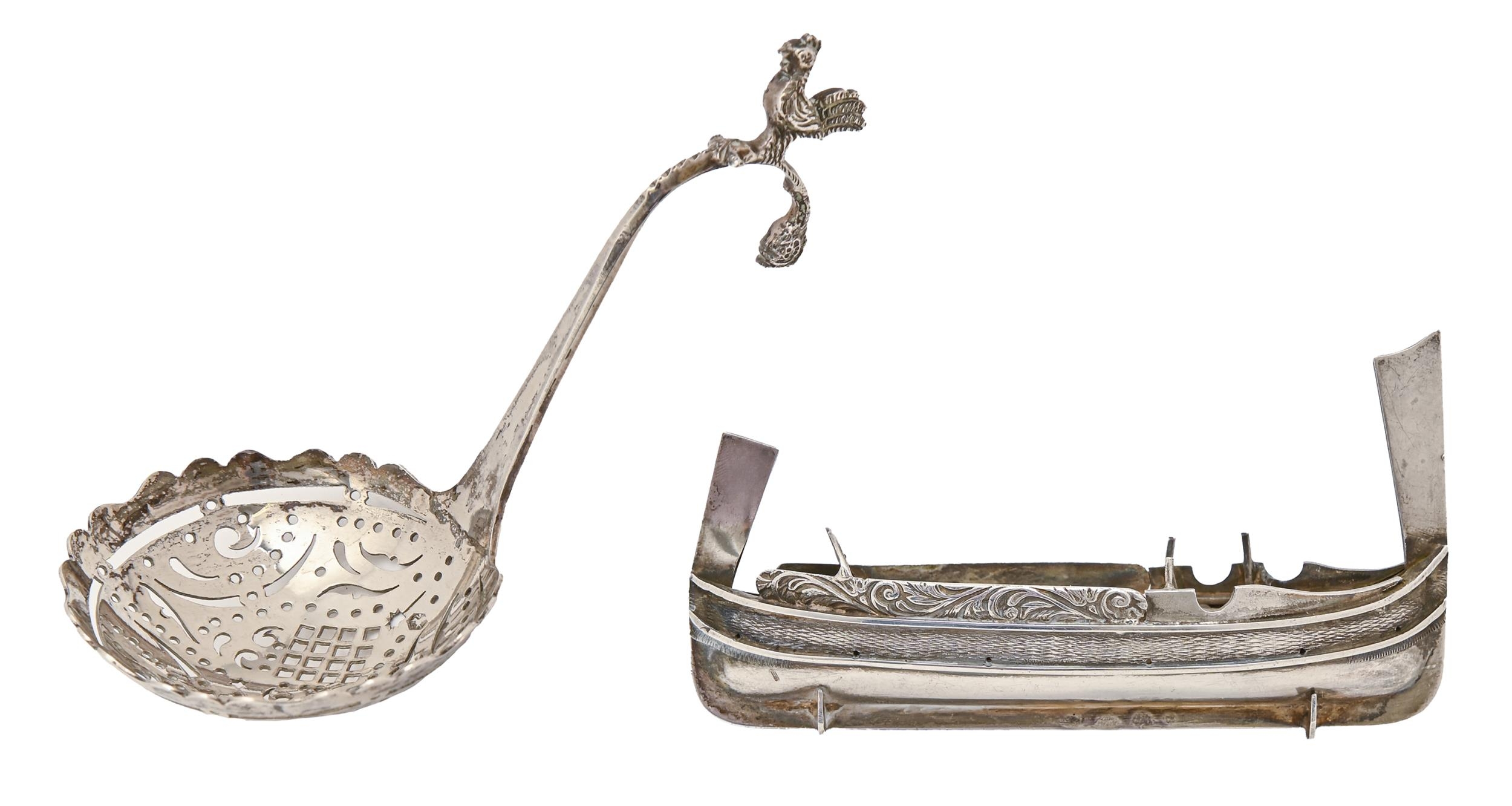 A Continental silver model of a rowing boat and a contemporary sugar sifter with bird terminal,