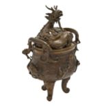 A Japanese bronze koro and cover, Meiji period, surmounted by a dragon, rich mid brown patina,