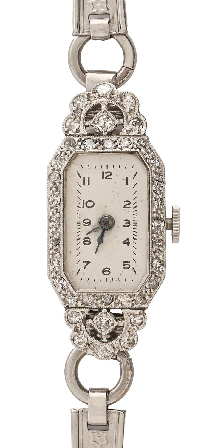 A diamond and white gold cocktail watch, c1940, Ibex movement, 14 x 33mm, stainless steel bracelet