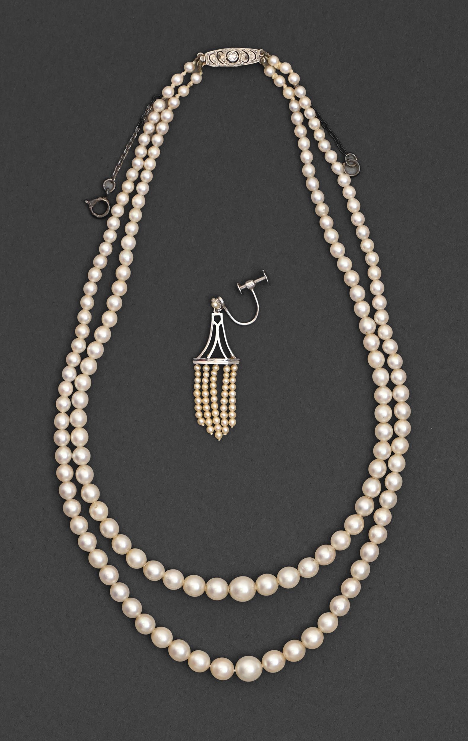 A cultured pearl necklace, of two rows of cultured pearls up to 7mm diam, diamond clasp and a