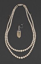 A cultured pearl necklace, of two rows of cultured pearls up to 7mm diam, diamond clasp and a