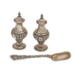 A pair of Edwardian silver ogee pepperettes and covers, 95mm h, by J Wiseman, Birmingham 1901 and