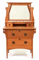 An oak  mirror back dressing table,  in Art Nouveau style,  154cm h; 92 x 56cm Shrinkage cracks to