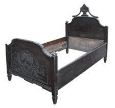 A Northern European carved oak bed, 170 x 107cm Foot board split, numerous scuffs and scratches