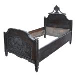 A Northern European carved oak bed, 170 x 107cm Foot board split, numerous scuffs and scratches