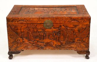 A Chinese camphor wood chest,  ornately carved with carp and figures, 59cm h; 101 x 53cm Good