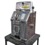 Mechanical gaming. A Jennings Decibel American slot machine or one armed bandit, polished chrome