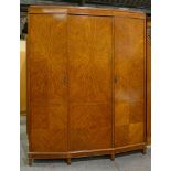 A satinwood and line inlaid spay fronted wardrobe, c1925, with radial veneers to the doors, 206cm h;