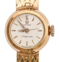 An Omega 18ct gold lady's wristwatch, Ladymatic, 18mm diam, on 18ct gold bracelet with plain