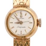 An Omega 18ct gold lady's wristwatch, Ladymatic, 18mm diam, on 18ct gold bracelet with plain